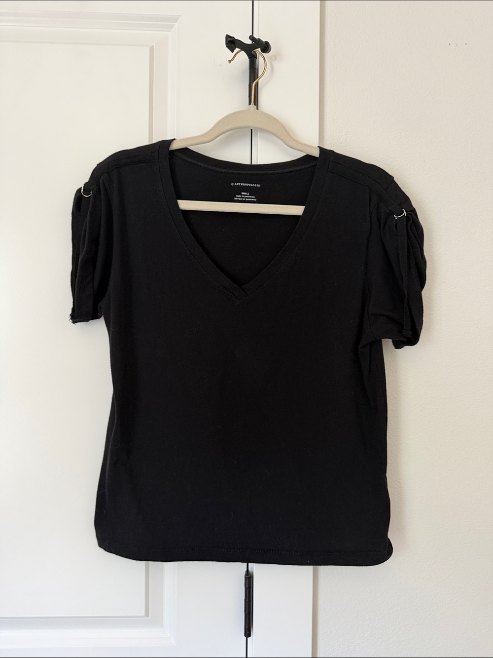 Anthropologie Black V-Neck Short Sleeve Top with Ring Detail